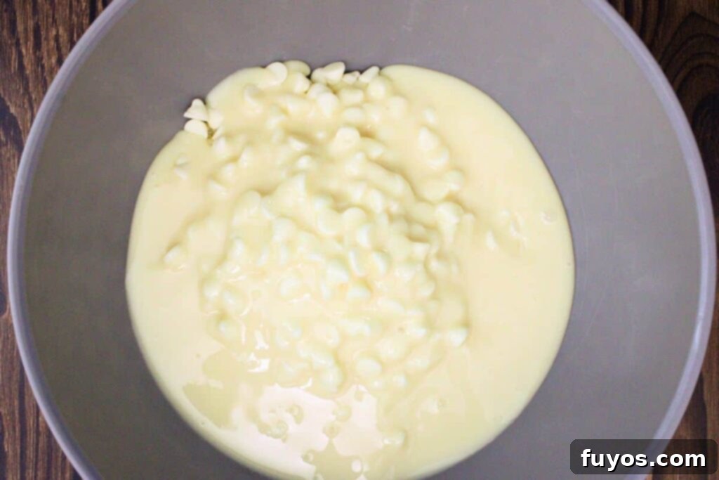 Effortless Holiday Gingerbread Fudge 5 add white chocolate chips and sweetened condensed milk to microwave safe bowl