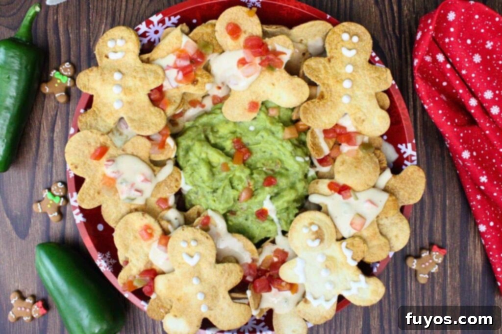 Gingerbread Nachos: A Festive & Fun Air Fryer Appetizer 8 Overhead view of a plate of gingerbread man nachos with queso and salsa surrounding guacamole