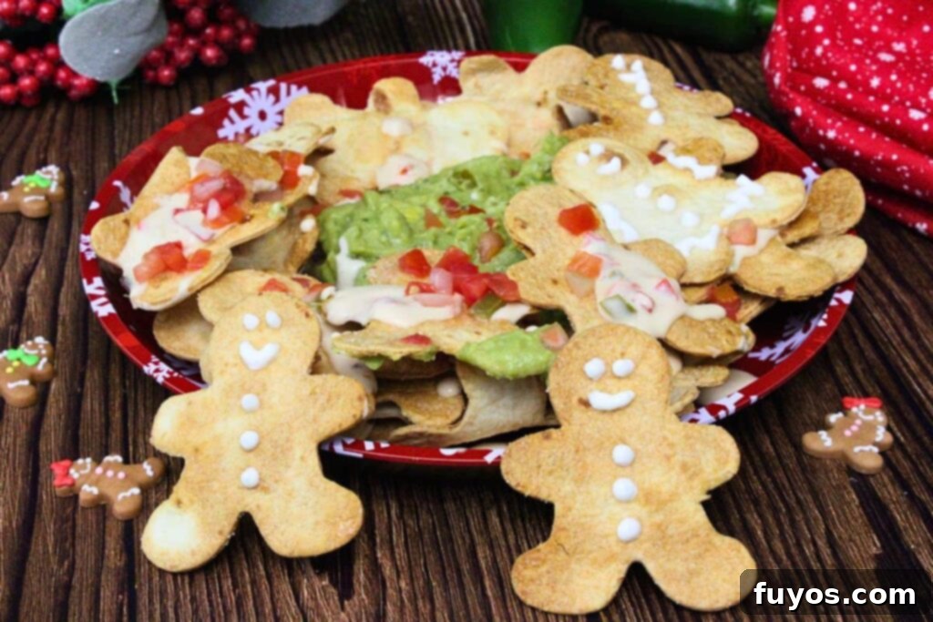 Gingerbread Nachos: A Festive & Fun Air Fryer Appetizer 9 Gingerbread man nachos decorated with sour cream and topped with queso, salsa, and guacamole
