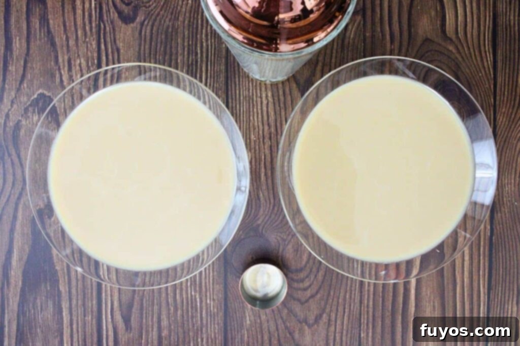 shake and strain chilled gingerbread martini into glasses