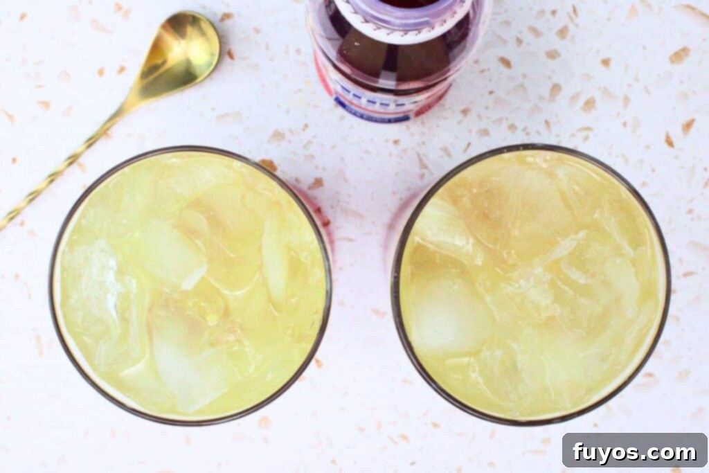 Layering Cranberry Juice in Bay Breeze Cocktail