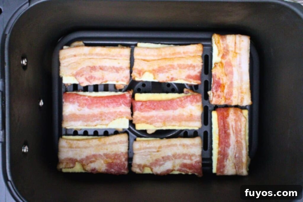 Crispy Air Fryer Bacon Bites: The Perfect Party Snack 7 Place bacon crackers in air fryer basket, making sure to leave room between each one