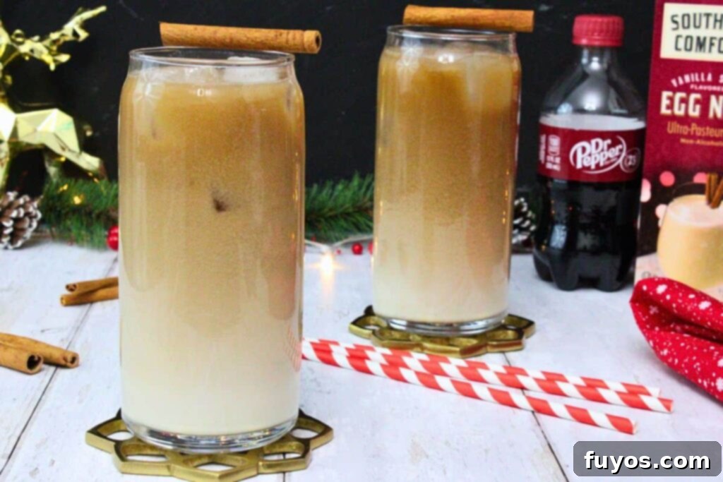 Dr Pepper Eggnog Rum Punch: A Festive Holiday Mixer 3 Two glasses of Dr Pepper eggnog with cinnamon stick garnishes