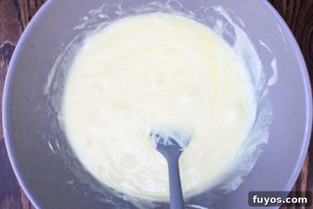 Eggnog Fudge: A Quick & Easy Holiday Delight 5 Combine white chocolate chips, sweetened condensed milk, and eggnog in a microwave-safe bowl.