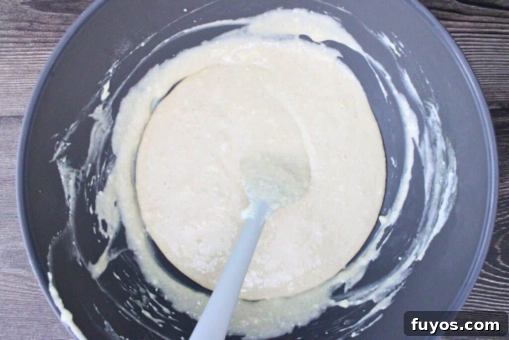 Mix cream cheese with sugar and add eggnog plus other spices then beat until smooth