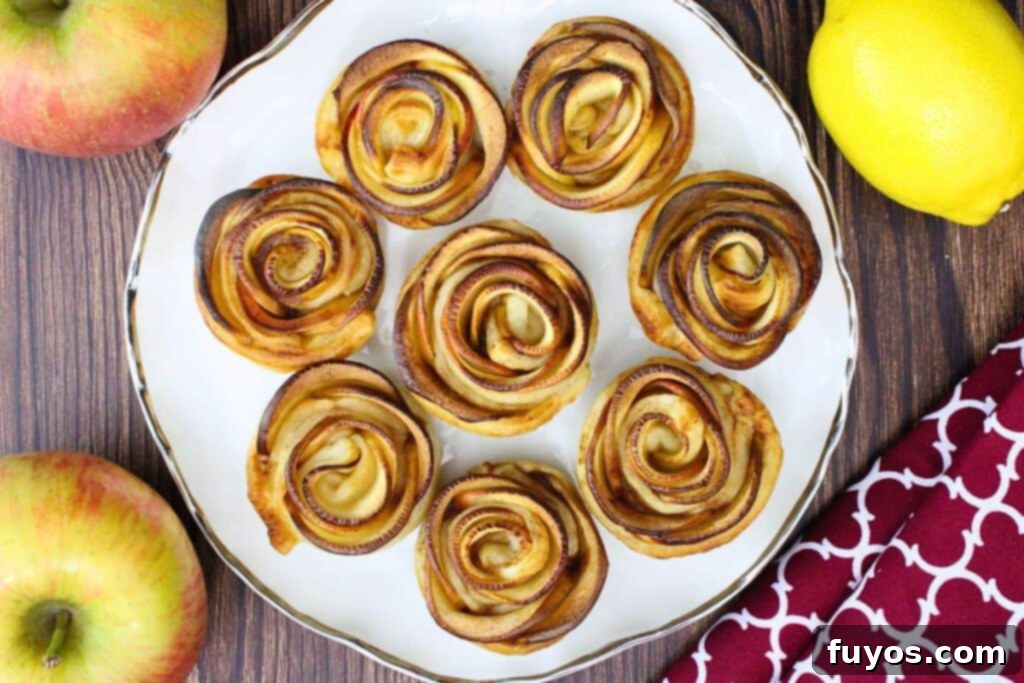 Overhead view of golden brown apple roses served on a plate