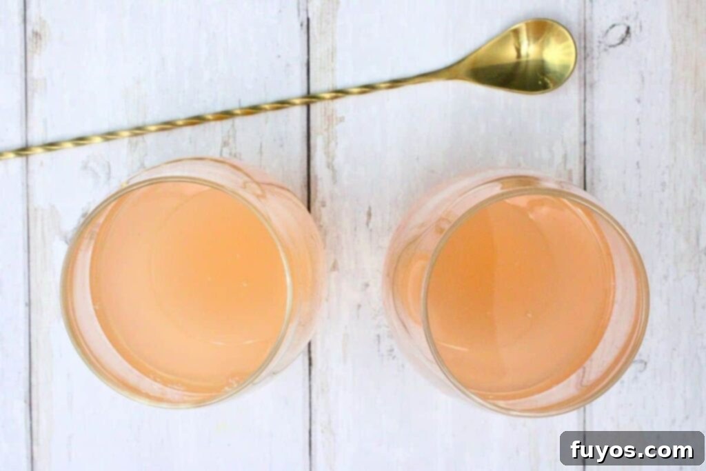 Pink Whitney Pink Lemonade Sangria 4 Mixing Moscato, Pink Whitney vodka, and pink lemonade in a glass