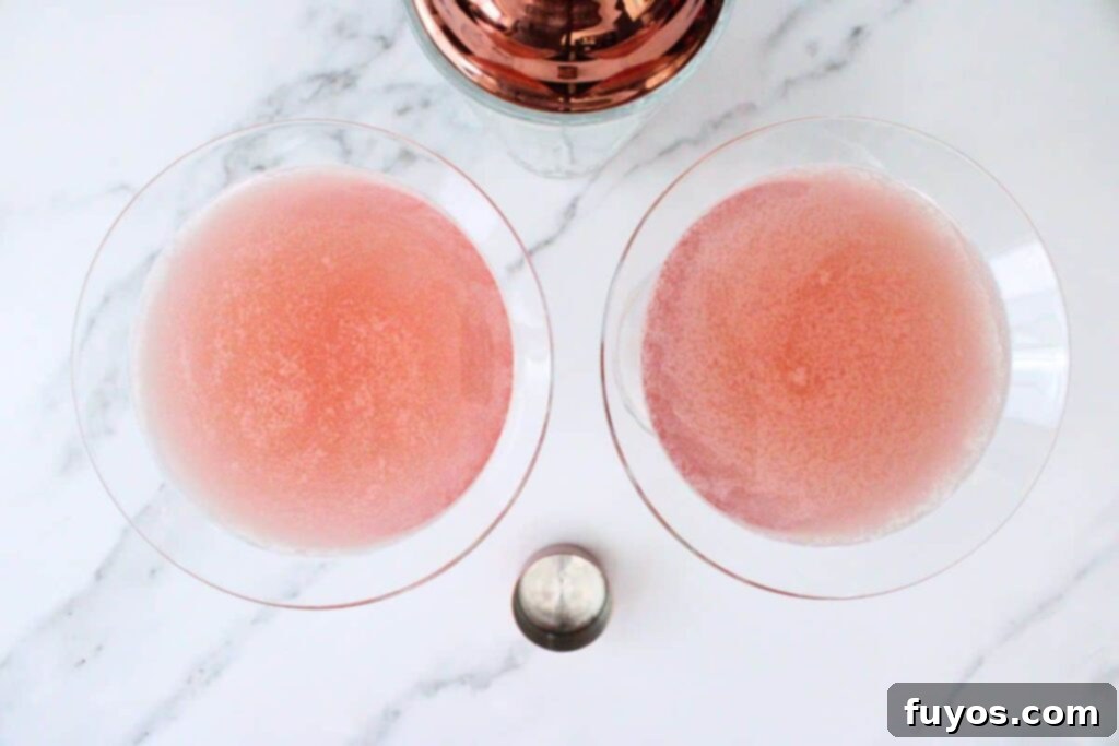 Pink Whitney Cosmo: A Refreshing Spin on the Classic Cosmopolitan 6 Shaking and straining Pink Whitney Cosmo