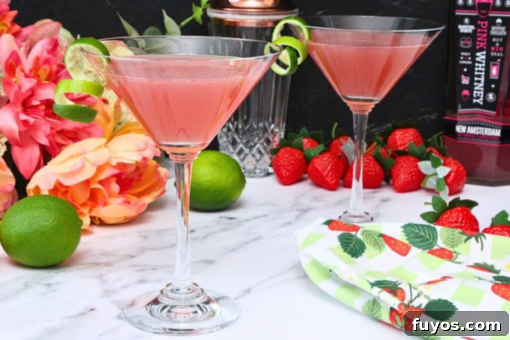 Pink Whitney Cosmo: A Refreshing Spin on the Classic Cosmopolitan 8 Pink Whitney Cosmos amongst fruit and flowers