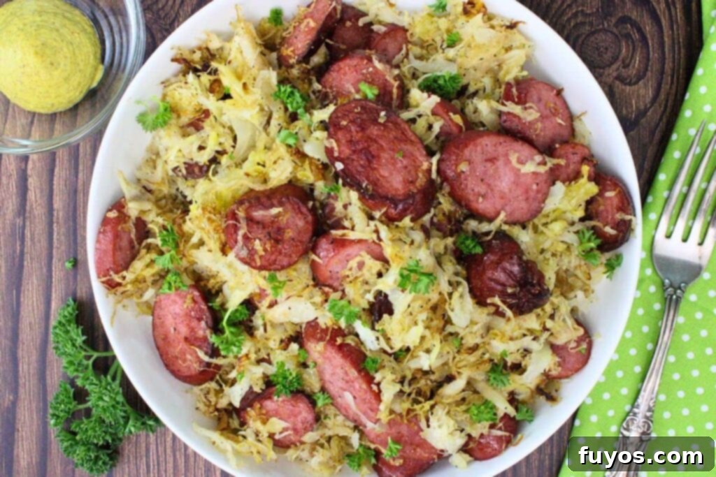 Overhead view of kielbasa and sauerkraut on a plate