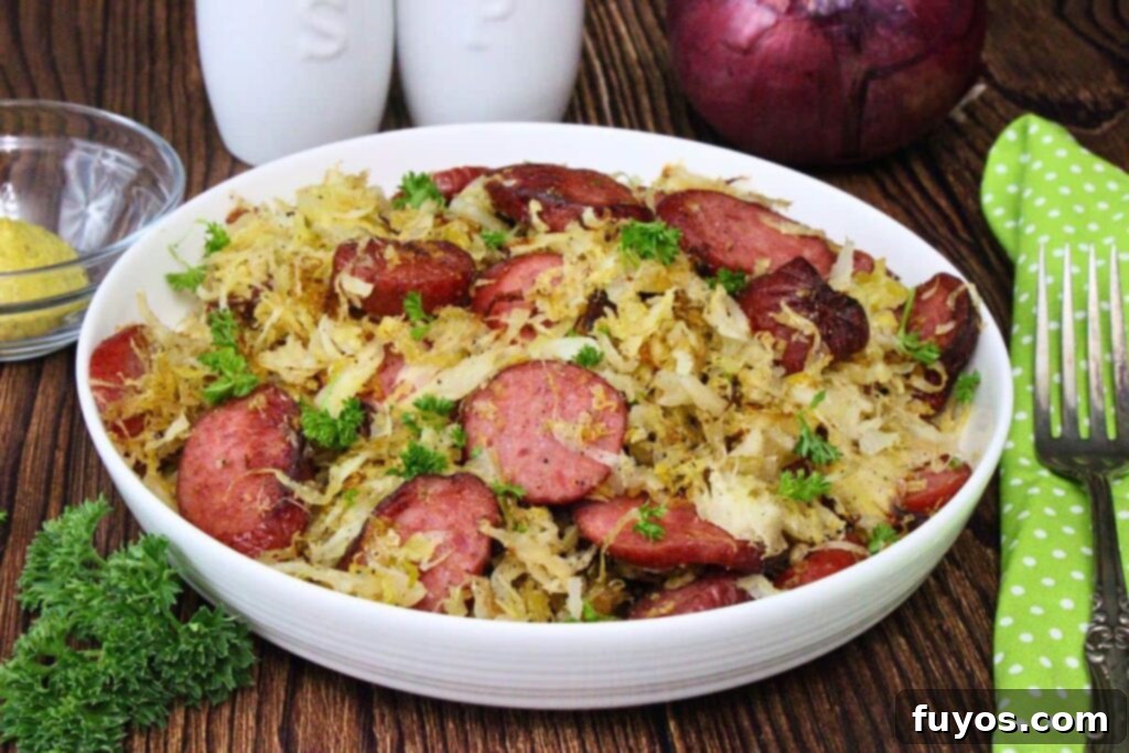 Shallow bowl filled with kielbasa and sauerkraut