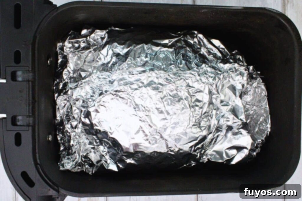 Place foil wrapped ham in air fryer basket