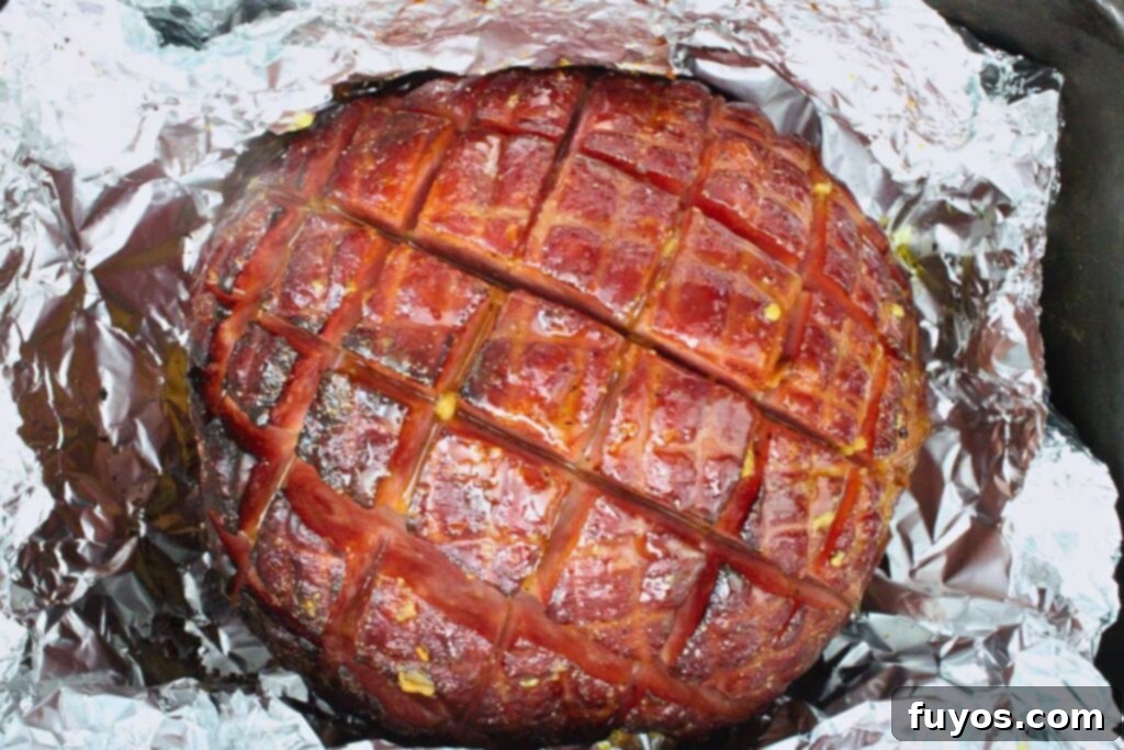 Add the remaining half of the glaze to your ham and cook until the glaze browns