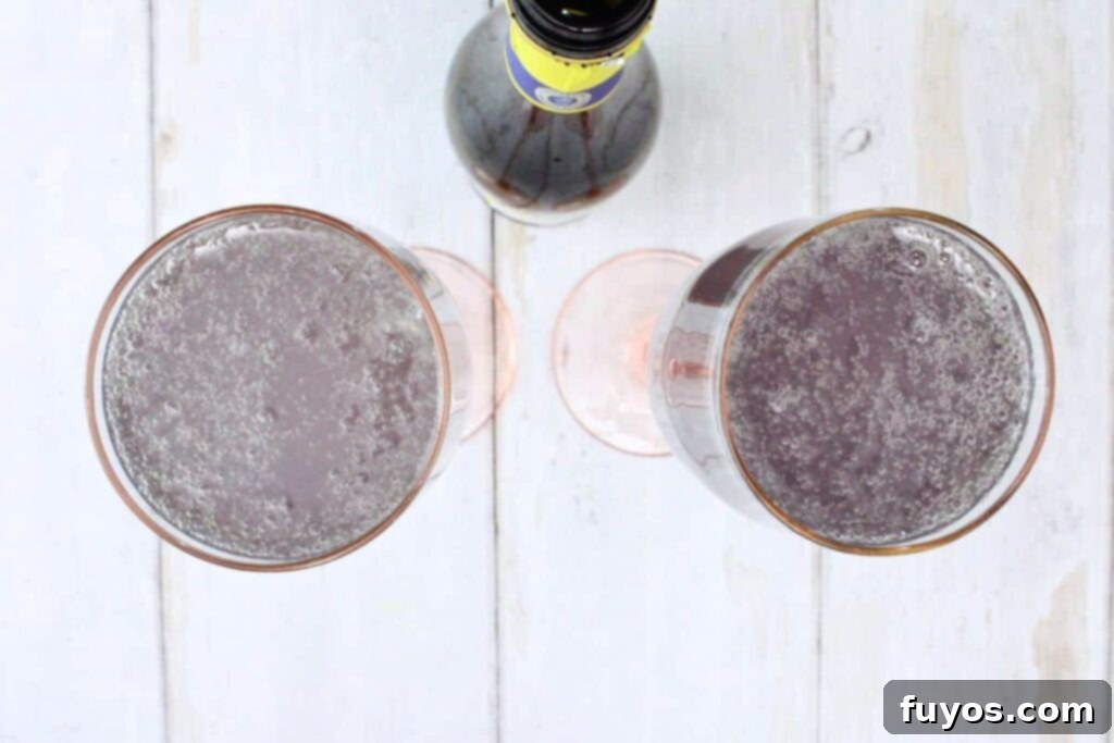 Lavender French 75: A Bubbly Spring Awakening 6 pour chilled champagne over lavender gin mixture