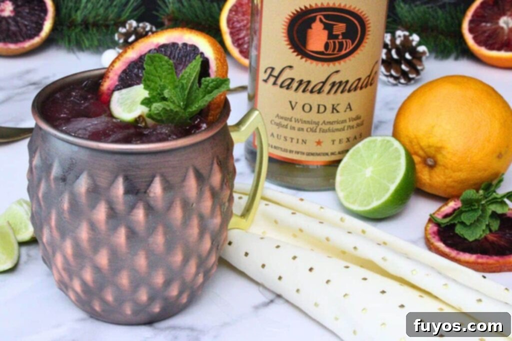 Blood Orange Bliss: A Zesty Vodka Ginger Beer Cocktail 3 Blood Orange Moscow Mule with garnishes