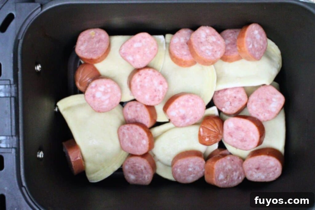 Flip partially cooked pierogies and add kielbasa